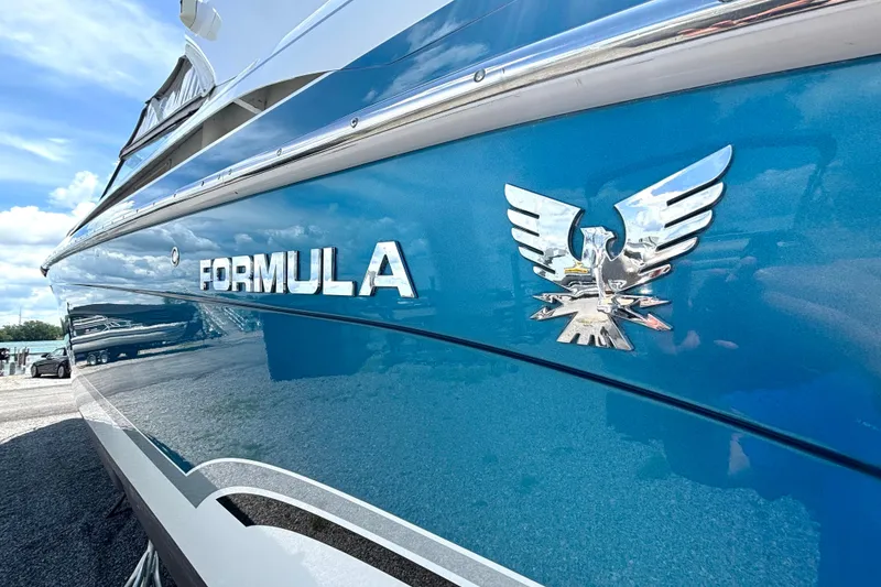 Slide: The Image of Blue 2006 Formula 400 Super Sport Crossover boat with emblem and logo. - 9
