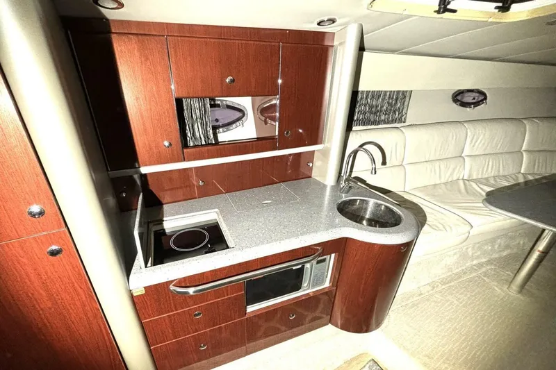Slide: The Image of Luxurious interior of 2006 Formula 400 Super Sport Crossover with kitchenette and seating area. - 34