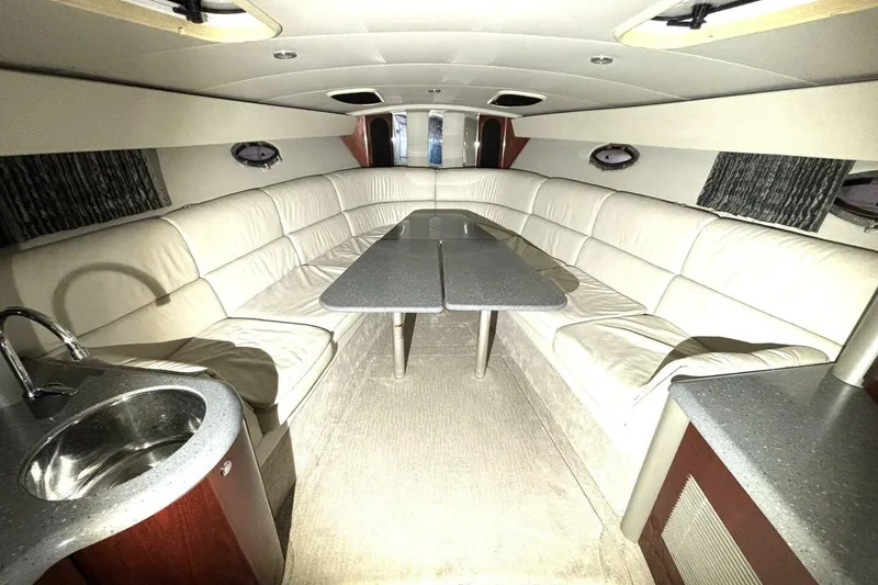 Slide: The Image of Luxurious interior of a 2006 Formula 400 Super Sport Crossover yacht with plush seating and table. - 36