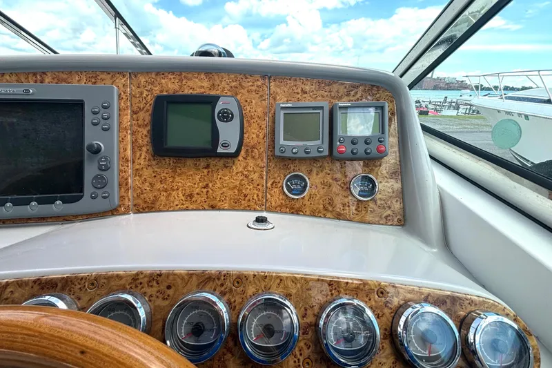 Slide: The Image of Dashboard of a 2006 Formula 400 Super Sport Crossover boat with navigation instruments. - 29