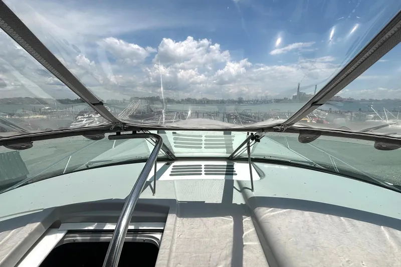 Slide: The Image of View from a 2006 Formula 400 Super Sport Crossover boat, overlooking a marina and skyline. - 32