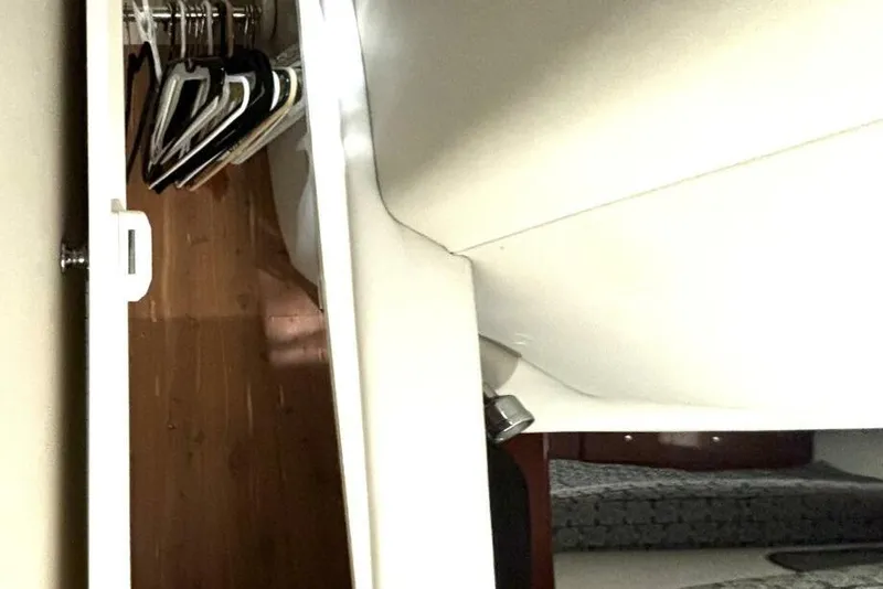 Slide: The Image of Interior view of a 2006 Formula 400 Super Sport Crossover with closet and hangers. - 42