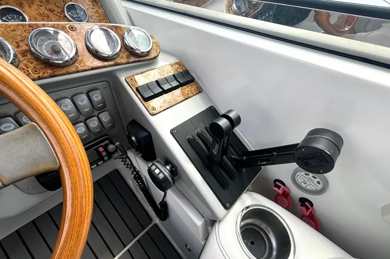Slide: The Image of Control panel of a 2006 Formula 400 Super Sport Crossover boat with wood accents and gauges. - 30