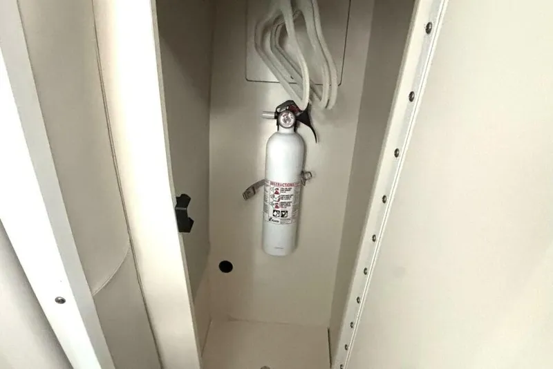 Slide: The Image of Fire extinguisher in a Formula 400 Super Sport Crossover boat closet, 2006 model. - 45