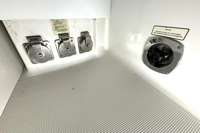 Slide: The Image of Control panel of a 2006 Formula 400 Super Sport Crossover boat with caution label. - 49