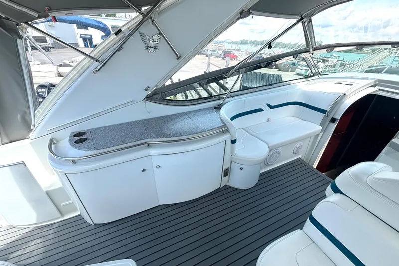Slide: The Image of Interior of a 2006 Formula 400 Super Sport Crossover boat, featuring sleek seating and cabinetry. - 21