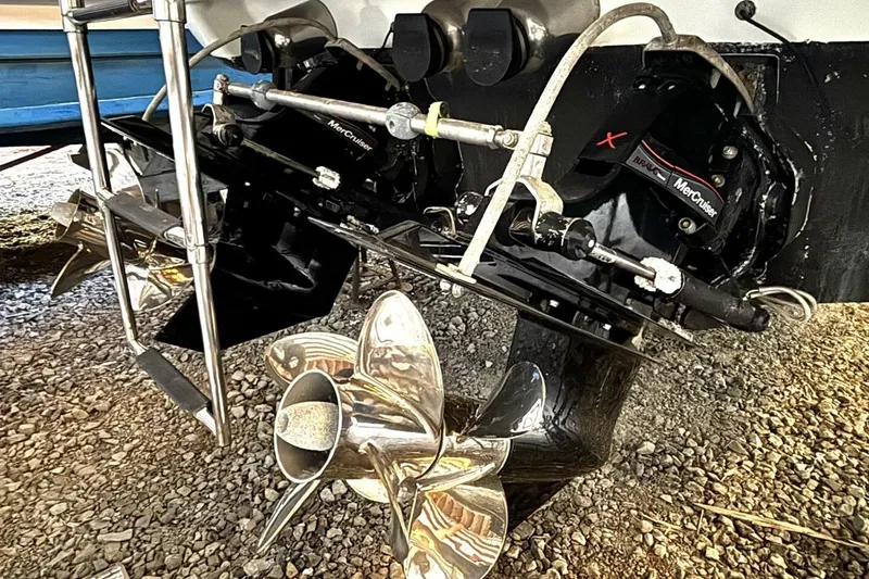 Slide: The Image of 2006 Formula 400 Super Sport Crossover boat with MerCruiser outdrives and propellers. - 54