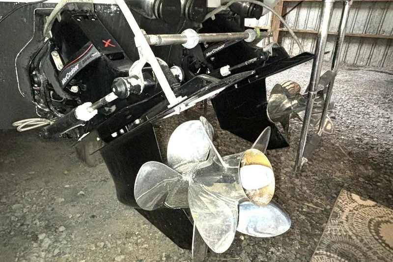 Slide: The Image of 2006 Formula 400 Super Sport Crossover boat with MerCruiser outdrive and propellers in storage. - 55