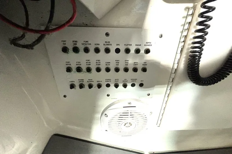 Slide: The Image of Control panel of a 2006 Formula 400 Super Sport Crossover boat with labeled switches. - 59