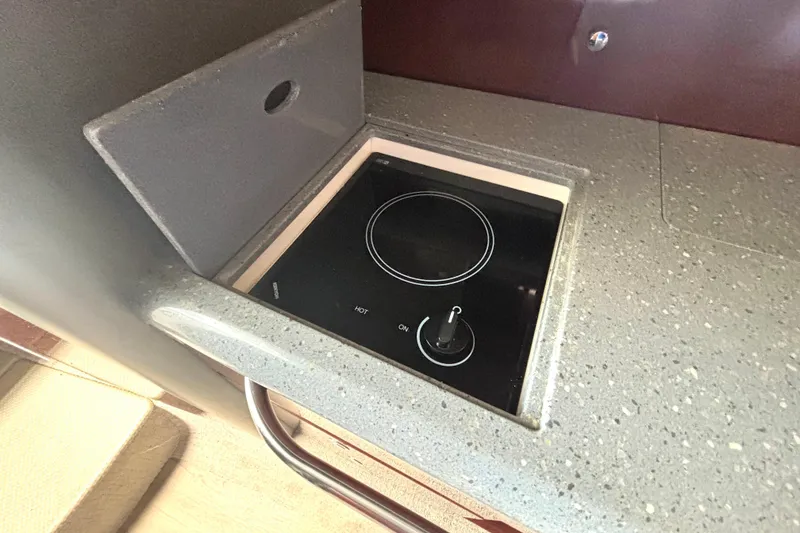 Slide: The Image of Compact stovetop in 2006 Formula 400 Super Sport Crossover yacht kitchen. - 38