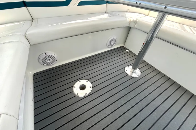 Slide: The Image of Interior of 2006 Formula 400 Super Sport Crossover boat with cushioned seating and speakers. - 20