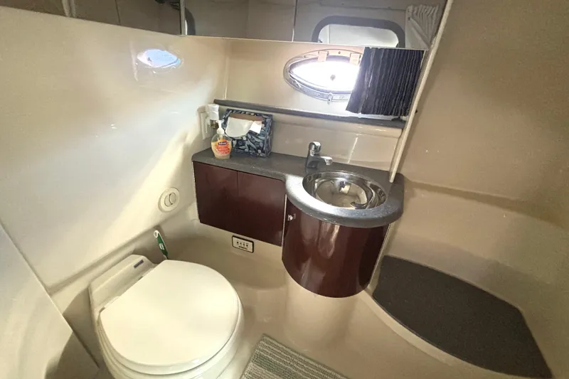 Slide: The Image of Luxurious bathroom in 2006 Formula 400 Super Sport Crossover yacht, featuring modern fixtures and porthole. - 49