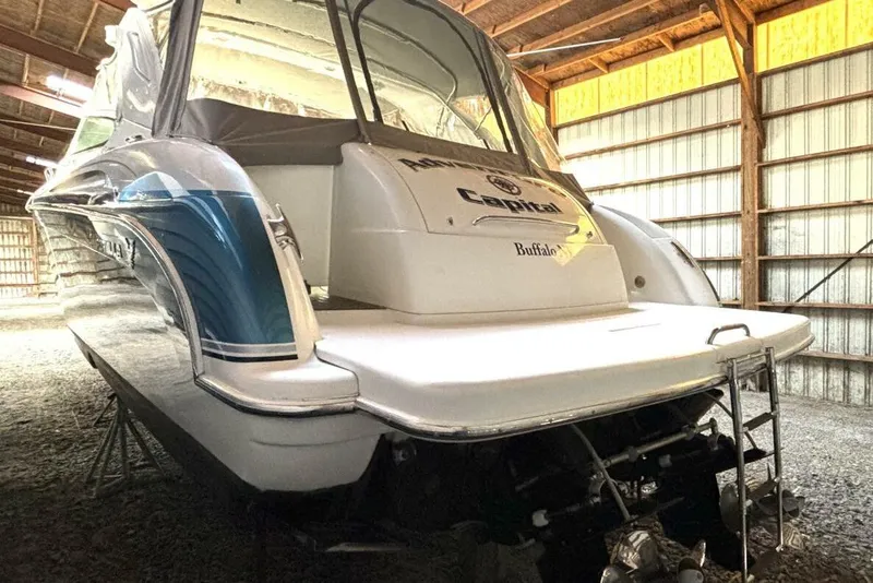 Slide: The Image of 2006 Formula 400 Super Sport Crossover boat in storage, rear view, indoors. - 8