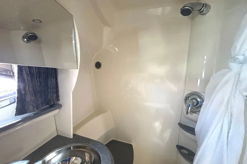 Slide: The Image of Interior of 2006 Formula 400 Super Sport Crossover boat bathroom with sink and shower. - 50