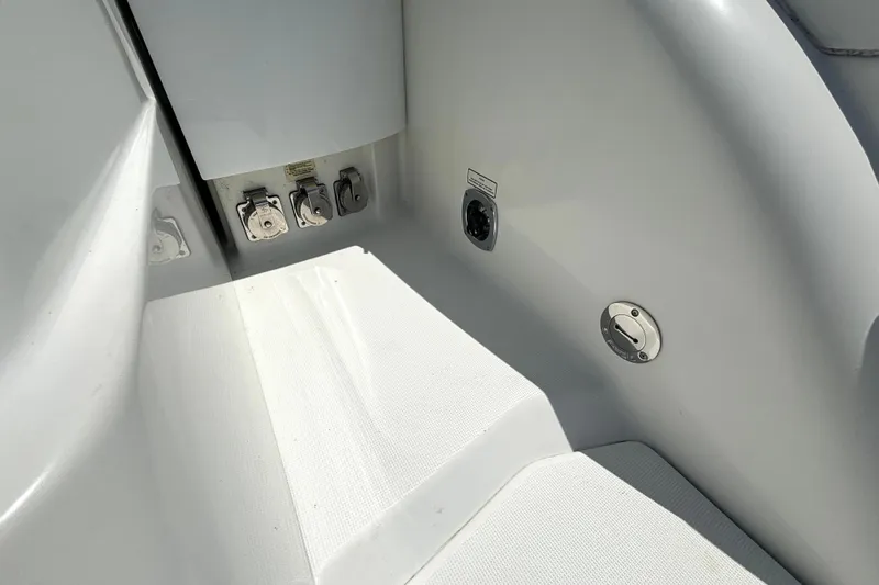Slide: The Image of Interior view of a 2006 Formula 400 Super Sport Crossover boat, showing utility connections. - 16