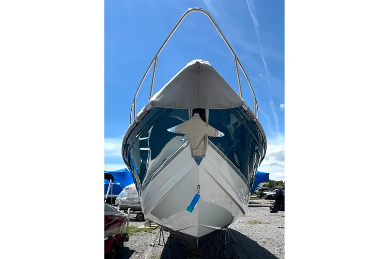 Slide: The Image of Front view of a 2006 Formula 400 Super Sport Crossover boat on land. - 3