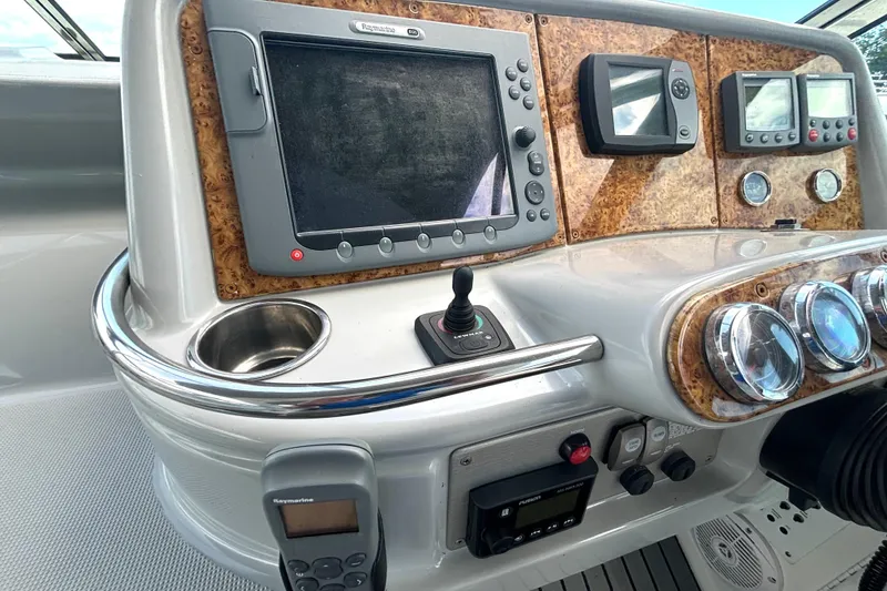 Slide: The Image of Control panel of a 2006 Formula 400 Super Sport Crossover boat with navigation equipment. - 28