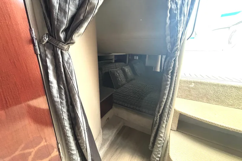 Slide: The Image of Interior cabin of 2006 Formula 400 Super Sport Crossover with cozy bedding and curtains. - 44