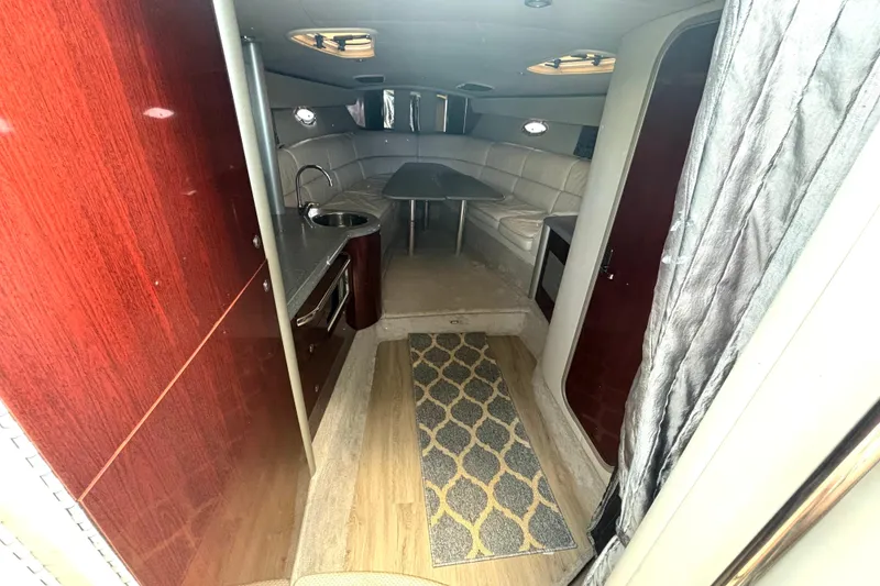 Slide: The Image of Interior of 2006 Formula 400 Super Sport Crossover yacht with seating and kitchenette. - 35