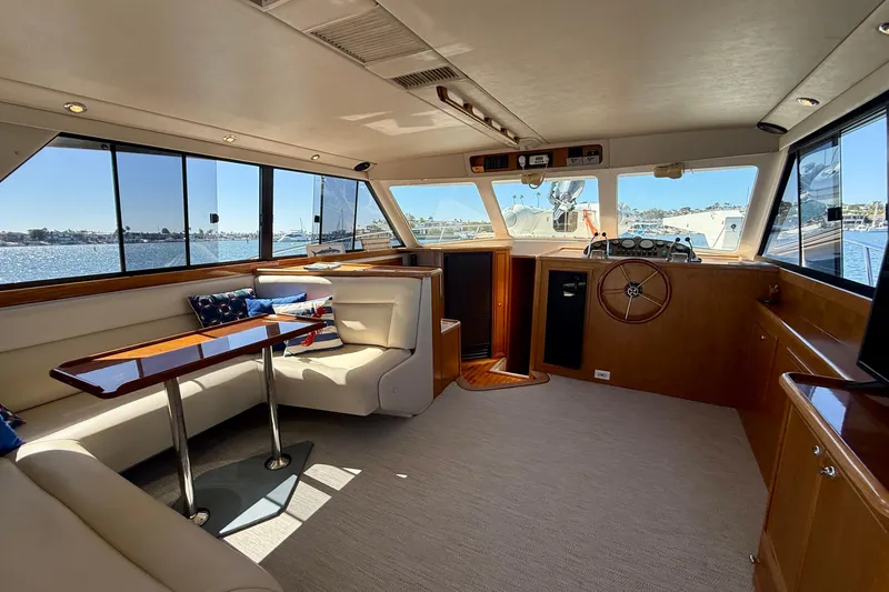 Slide: The Image of Luxurious interior of 1998 Riviera 43 Open Flybridge yacht with scenic water views. - 13