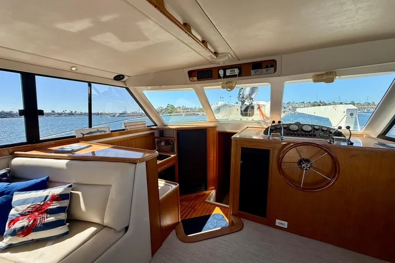 Slide: The Image of Interior of 1998 Riviera 43 Open Flybridge yacht with helm and seating area. - 18