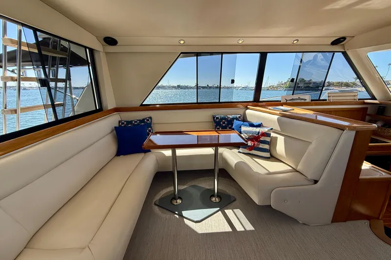 Slide: The Image of Luxurious interior of 1998 Riviera 43 Open Flybridge yacht with waterfront view. - 20