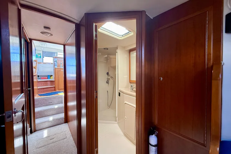 Slide: The Image of Interior of 1998 Riviera 43 Open Flybridge yacht, featuring bathroom and hallway. - 35