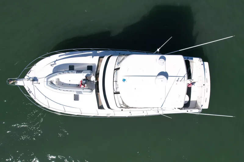 Slide: The Image of Overhead view of 1998 Riviera 43 Open Flybridge yacht on water. - 4