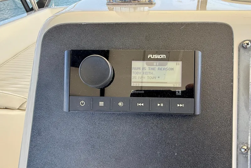 Slide: The Image of Fusion stereo system on 1998 Riviera 43 Open Flybridge, playing Toby Keith's "Rum is the Reason." - 57