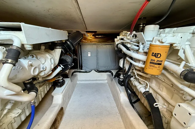 Slide: The Image of Engine room of 1998 Riviera 43 Open Flybridge with CAT components and piping. - 66
