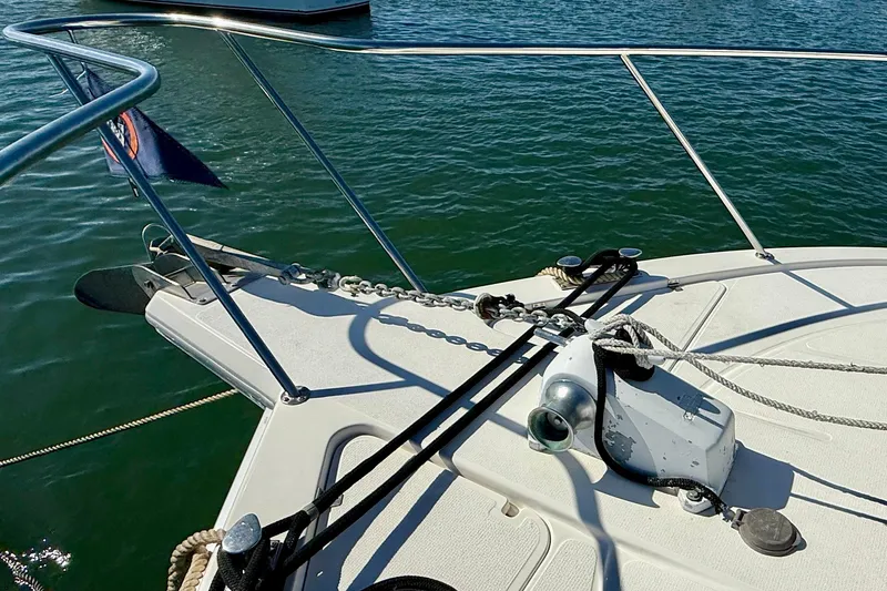 Slide: The Image of Bow of 1998 Riviera 43 Open Flybridge yacht with anchor and ropes. - 77