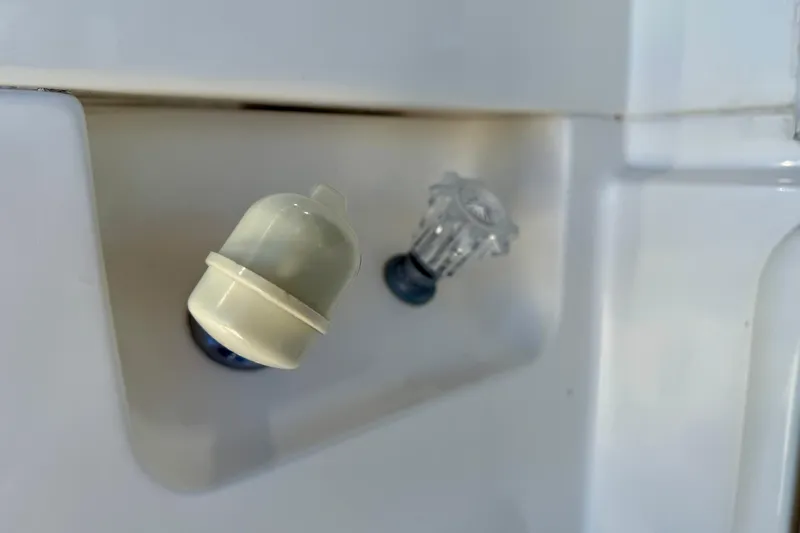 Slide: The Image of Close-up of a 1998 Riviera 43 Open Flybridge boat's control knobs. - 78