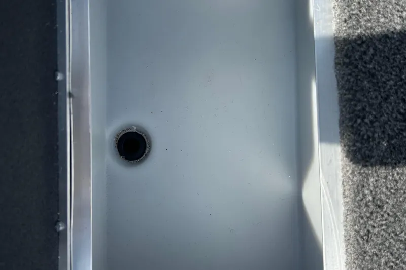 Slide: The Image of Interior view of 2026 Lund 1975 Tyee boat, featuring a drain hole. - 14