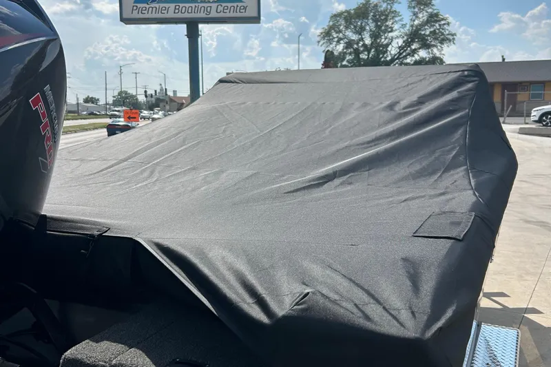 Slide: The Image of Covered 2026 Lund 1975 Tyee boat at Premier Boating Center parking lot. - 25
