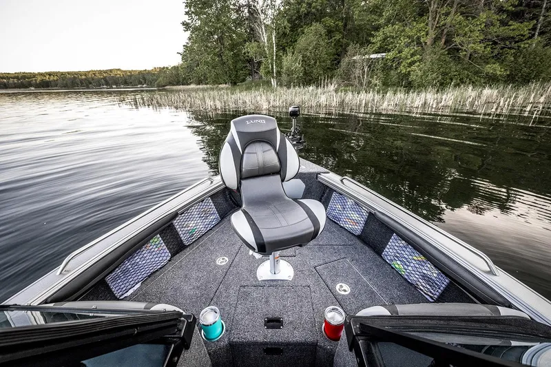 Slide: The Image of 2026 Lund 1975 Tyee boat on trailer at Premier Boating Center under cloudy sky. - 3