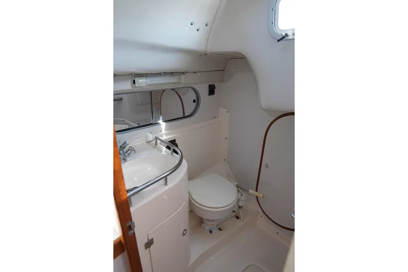 Slide: The Image of 2007 J Boats J/124 yacht bathroom with sink, toilet, and mirror. - 13