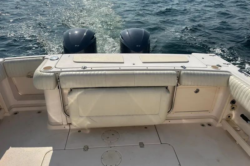 Slide: The Image of 2008 Grady White Express boat with dual engines on open water. - 15