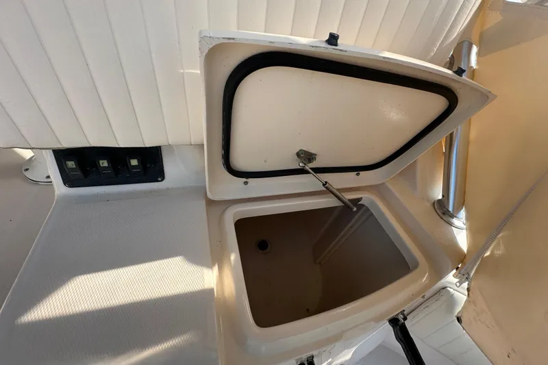 Slide: The Image of Open storage compartment on 2008 Grady White Express boat interior. - 16