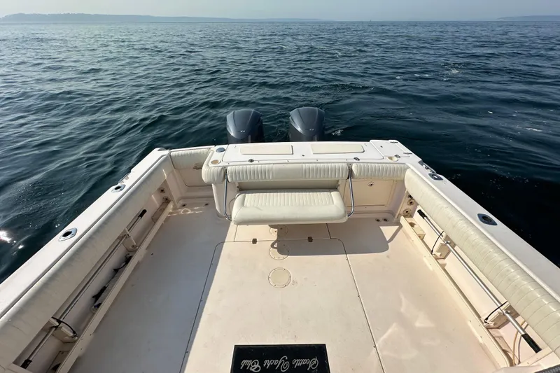 Slide: The Image of 2008 Grady White Express boat deck with twin engines on open water. - 20