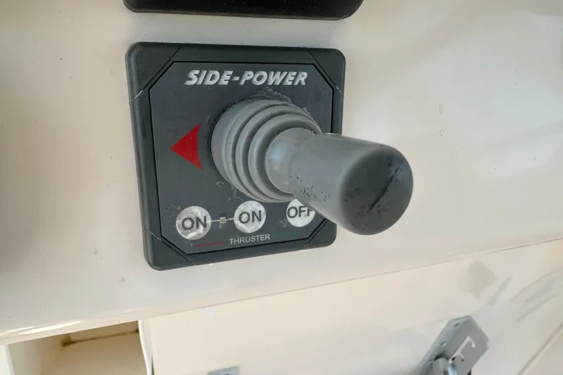 Slide: The Image of Side-Power thruster control on 2008 Grady White Express boat dashboard. - 27