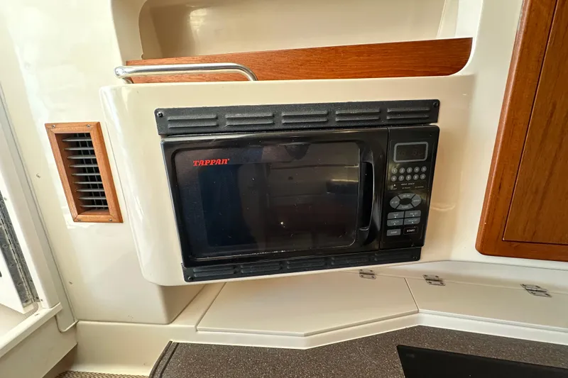 Slide: The Image of 2008 Grady White Express boat kitchen with Tappan microwave oven. - 43