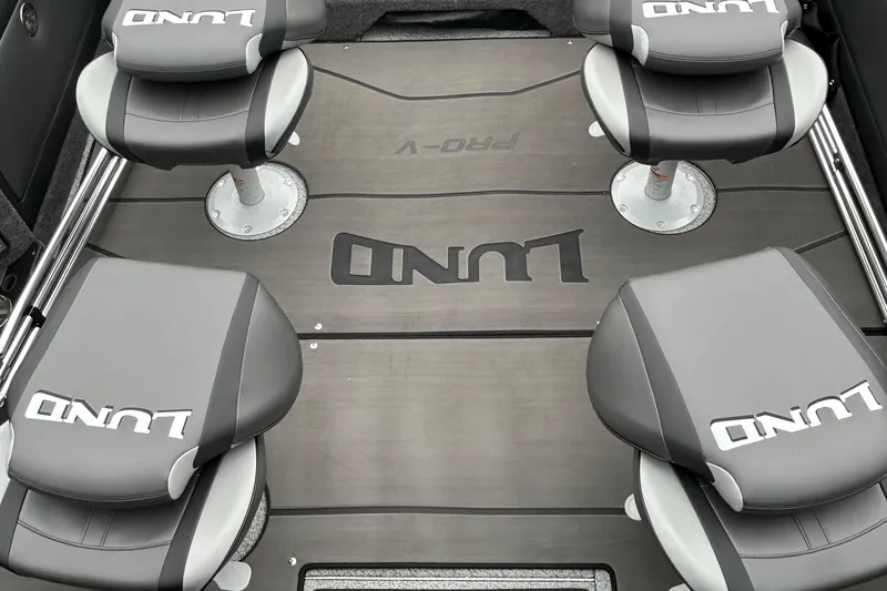 Slide: The Image of Interior of 2026 Lund 1975 Pro-V boat with four branded seats. - 11