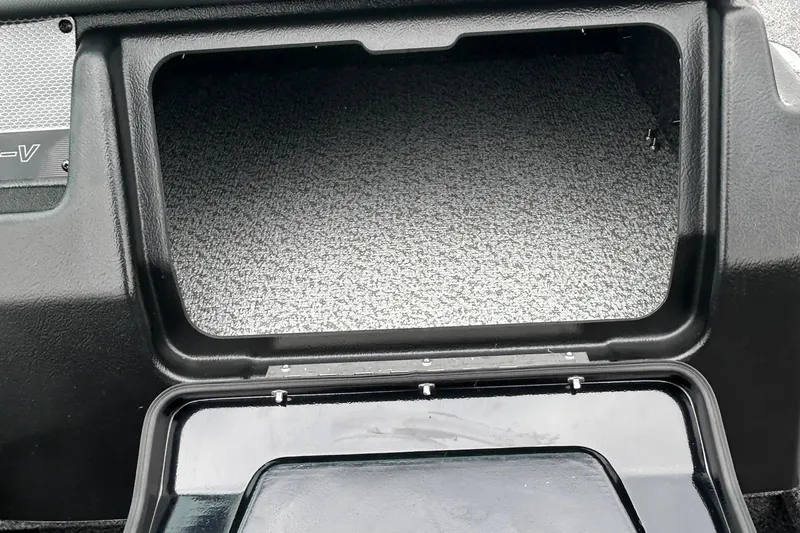 Slide: The Image of Open storage compartment in 2026 Lund 1975 Pro-V boat dashboard. - 12