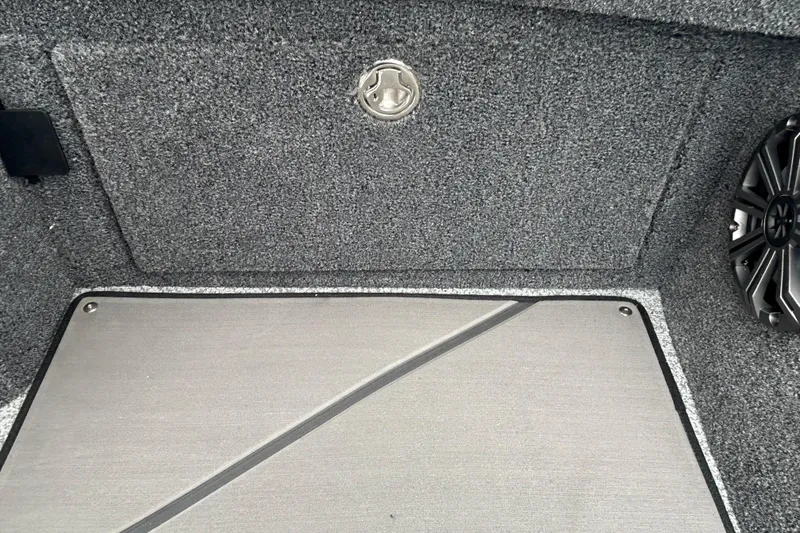 Slide: The Image of Interior of 2026 Lund 1975 Pro-V boat with speaker and storage compartment. - 13