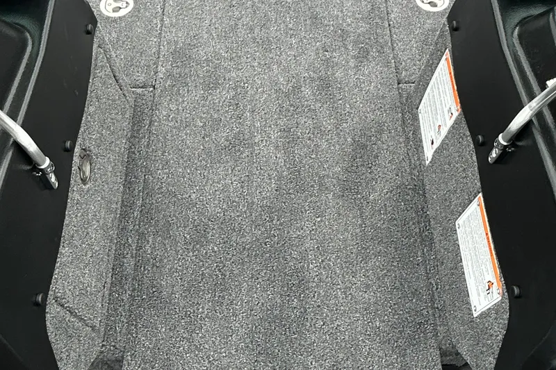 Slide: The Image of Interior view of 2026 Lund 1975 Pro-V boat with gray carpet flooring. - 18