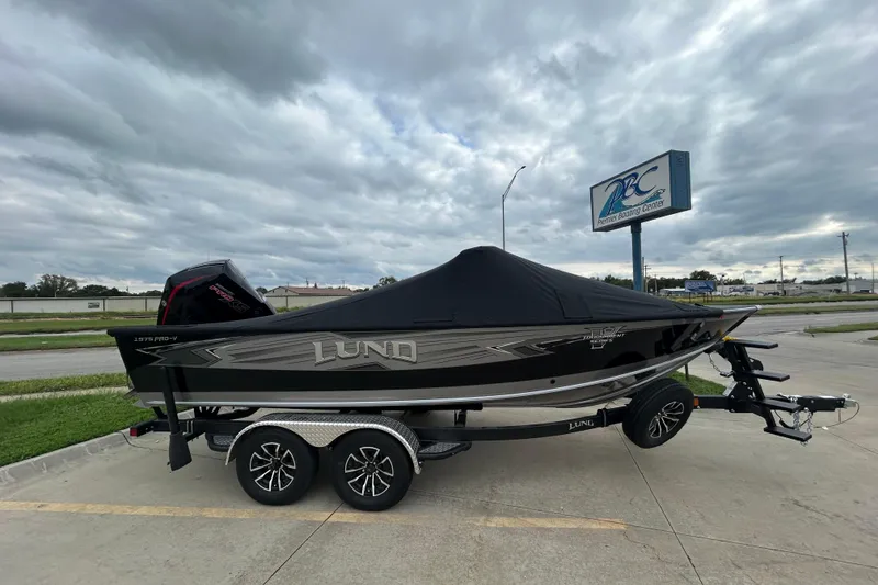 Slide: The Image of 2026 Lund 1975 Pro-V boat with cover on trailer at Premier Boating Center. - 32
