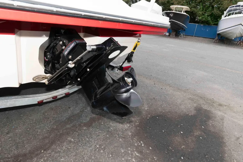 Slide: The Image of 2018 Sea Ray SPX 190 boat with MerCruiser engine, parked on gravel. - 15