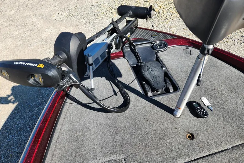 Slide: The Image of 2013 Triton 19XS boat deck with Minn Kota trolling motor and control panel. - 19