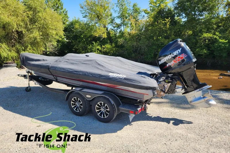 Slide: The Image of Covered 2013 Triton 19XS boat with Mercury Pro XS engine on a trailer. - 27