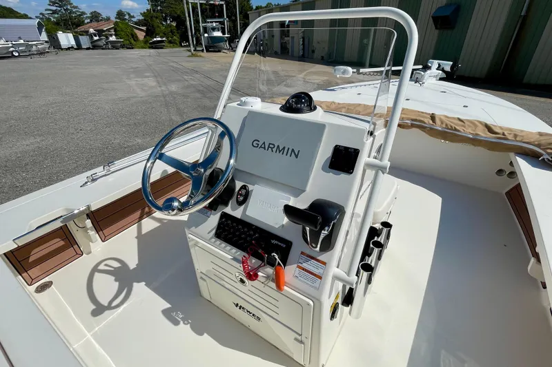 Slide: The Image of 2022 Hewes Redfisher 21 boat console with Garmin navigation system and steering wheel. - 18